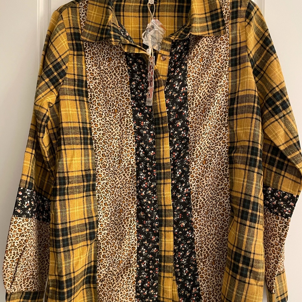 Long sleeve, Button down, multi- patterned shirt.